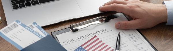 A completed visa application form on a desk.